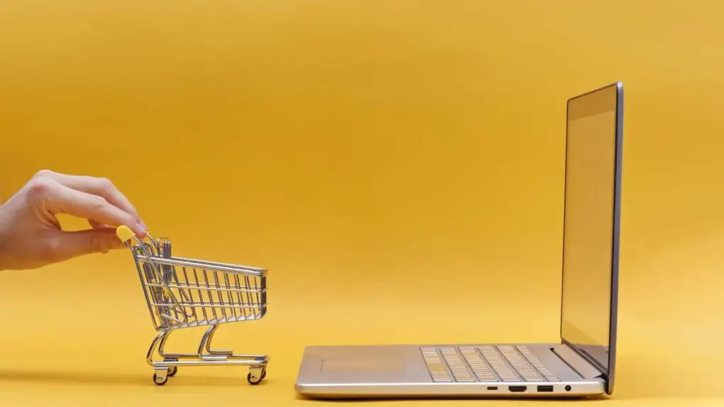 a laptop and a shopping cart, 10 Expert-Recommended e-commerce quick fixes to Elevate Your Business Revenue